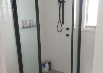 Corner sliding door shower in black installed in Edwardstown.